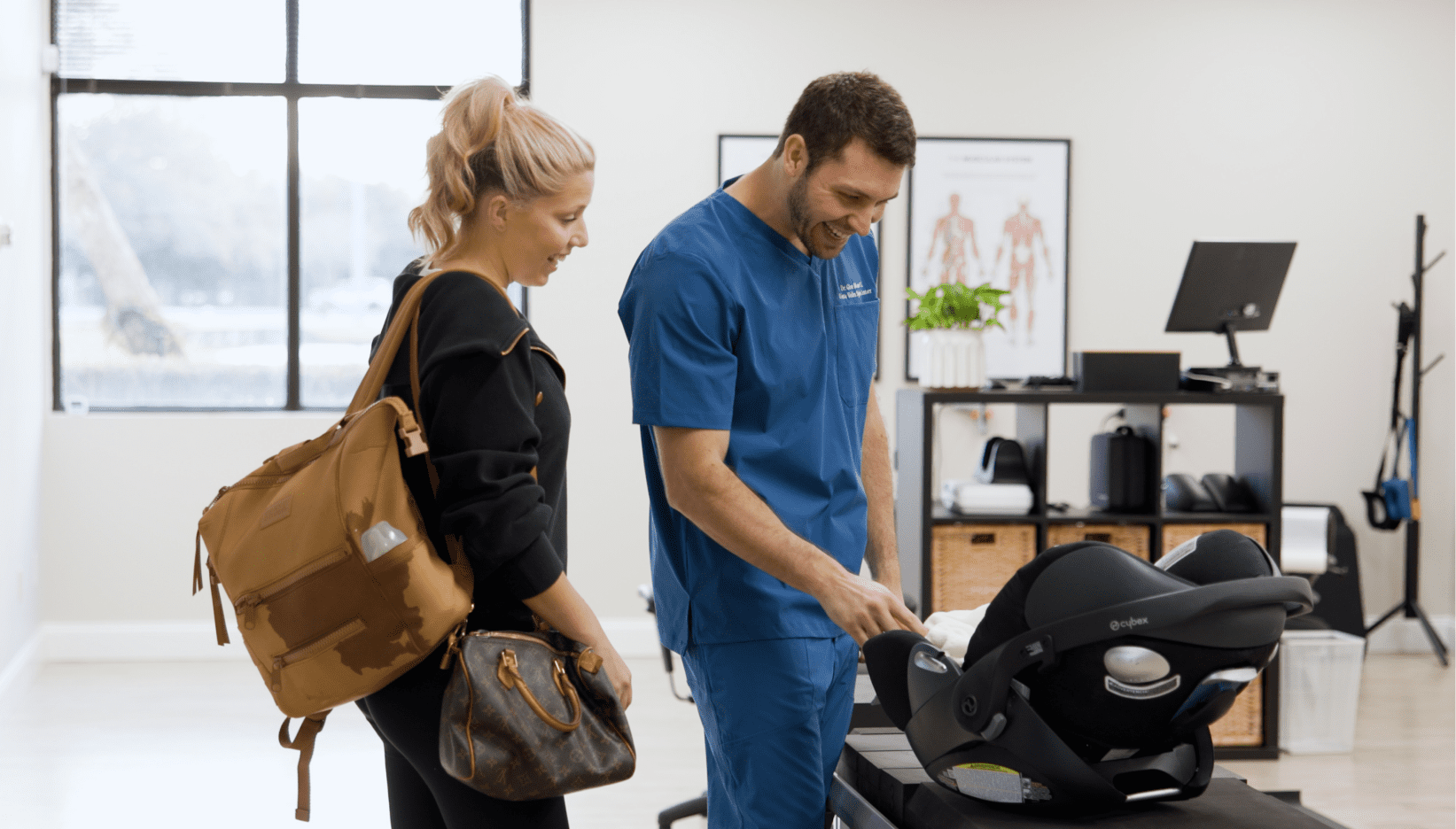 Dr. Gion Monn smiling to his baby patient