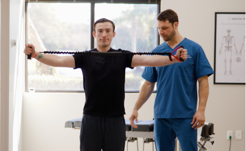A male patient doing rehabilitation exercise at Ponte Vedra Spine Center.
