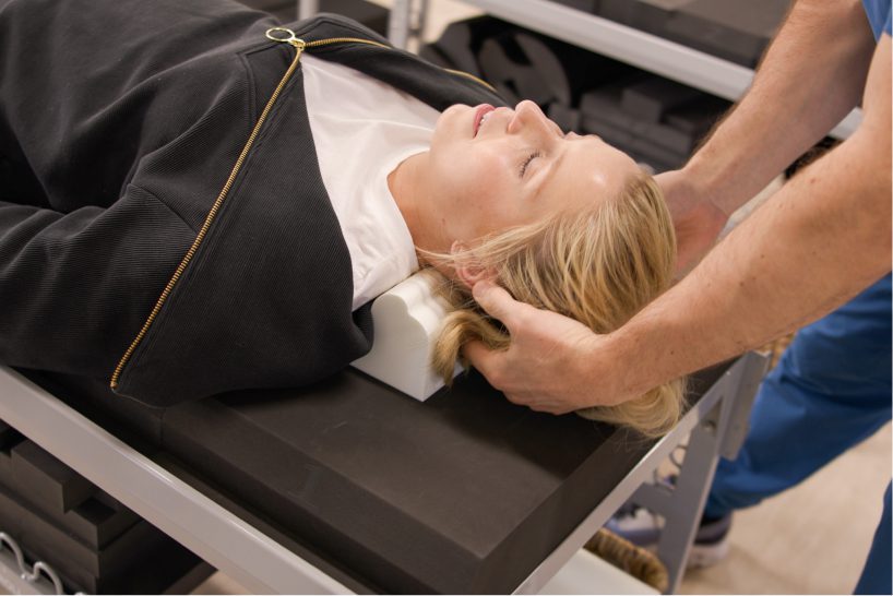 Patient being prepared for a chiropractic therapy