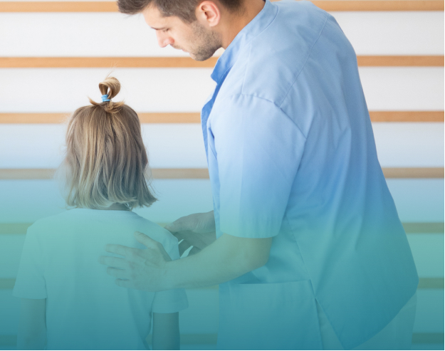 Chiropractor assessing a child for therapy.