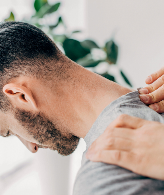 A man's lower neck being assessed for